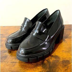 Black Oxford style platforms. Never worn, size 7 1/2 in women’s.